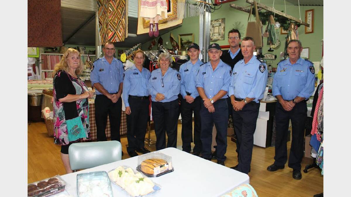In Stitches member Sue Hodgkinson with representatives from the Glengarry, Gravelly Beach and Bridgenorth fire brigades.
