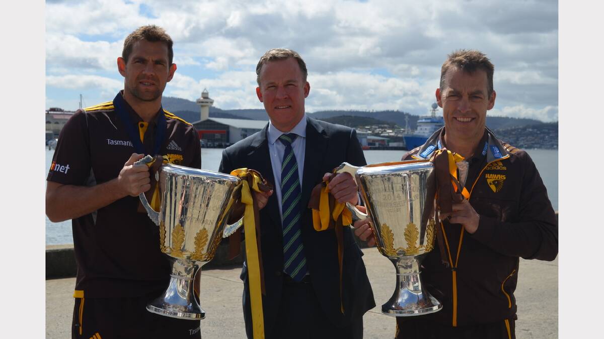  Premier Will Hodgman with Hawks captain Luke Hodge and coach Alistair Clarkson  in Hobart. Picture: Georgie Burgess
