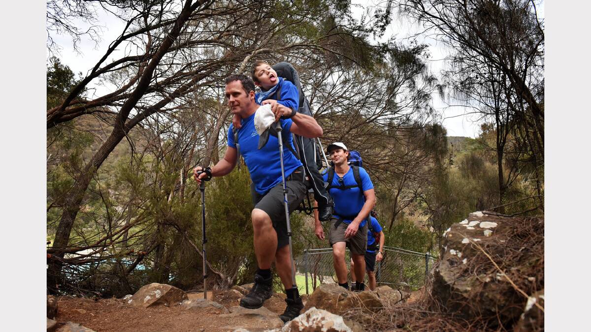 Chris Duffy and his son Jack, 8, plan to walk the Overland Track next month to raise money for Life Without Barriers. Picture: SCOTT GELSTON