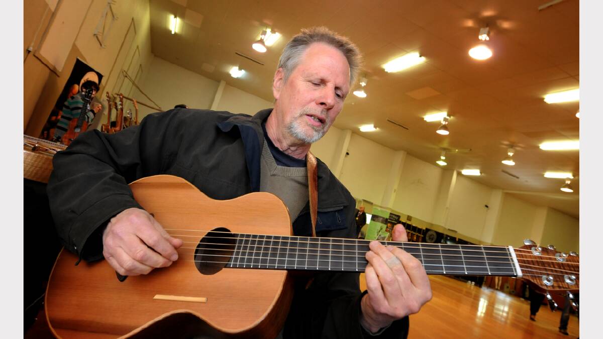 Daniel Brauchli, of Lilydale, showcases one of his handmade guitars at StringFest. Picture: GEOFF ROBSON