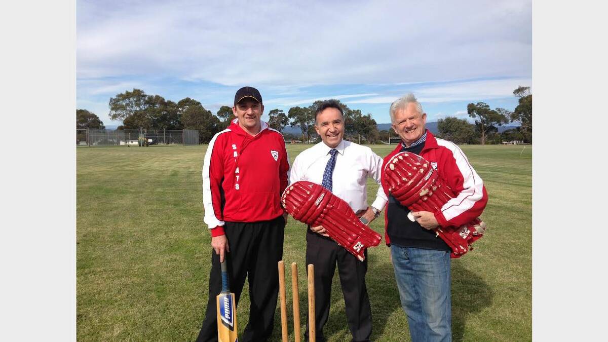 Coach of George Town Cricket Club Robbie Crane with Bass Liberal MHR Andrew Nikolic and club president Bob Pooley.
