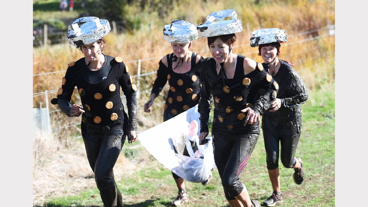 Jenny Rossetto, Sian Walters, Sarah Read and Amanda Watson enjoy some clean fun at the Tas Mud Run. Picture: Mark Jesser
