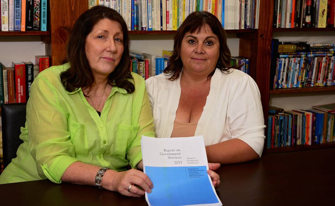 Magnolia Place's Jenny and Amanda with the 2015 Government Services Housing and Homeless report. Picture: Phillip Biggs