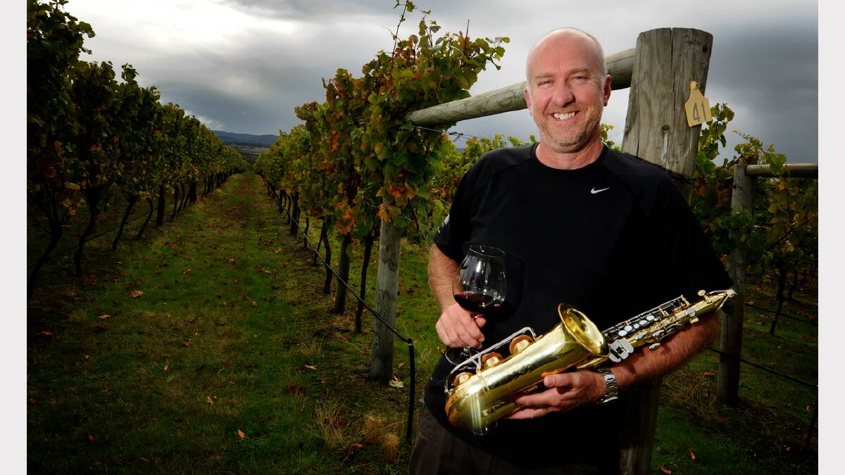 Goaty Hill Wines co-owner Tony Nieuwhof dusts off an old saxophone in preparation for today's Friends in the Vineyard fund-raiser for Bravehearts. Picture: GEOFF ROBSON.