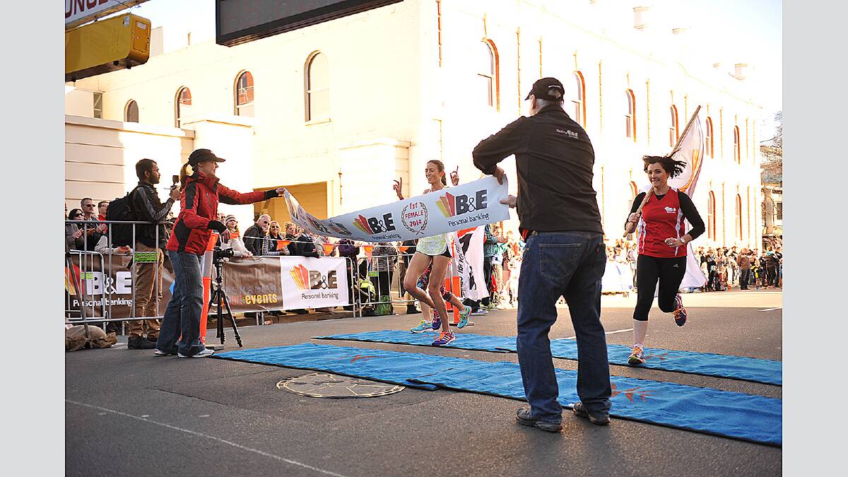Madeline Heiner crosses the line in first position to win the Launceston Ten women's race. Picture: Scott Gelston
