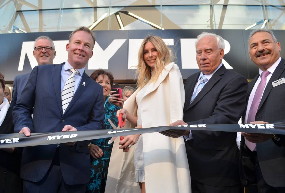 Premier Will Hodgman and Jennifer Hawkins cut the ribbon to open the new Hobart Myer store on Thursday. Picture: GEORGIE BURGESS