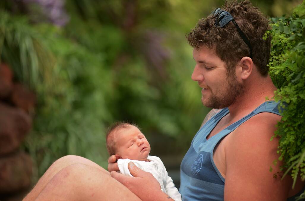 Daniel Roozendaal with newborn daughter Grace. Picture: PHILLIP BIGGS