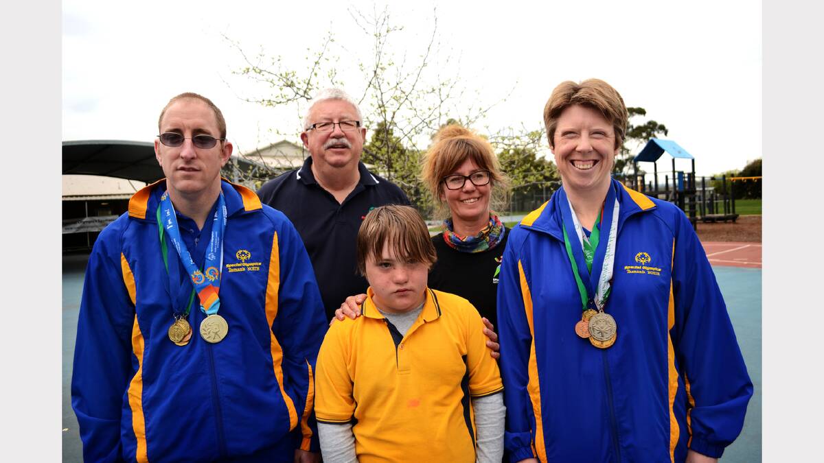 Special Olympic swimmers Tim Beattie and Jacquie Spencer with Special Olympics Tasmania vice chairman Chris Crawford, Kristen Mathiassen and Lucah Mathiassen.