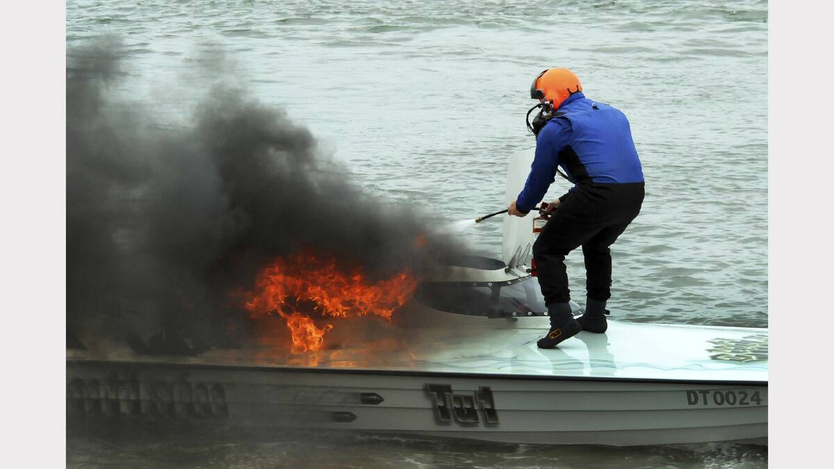 Neil Richardson: A fire aboard a power racing boat at the Devonport Regatta is extinguished. 