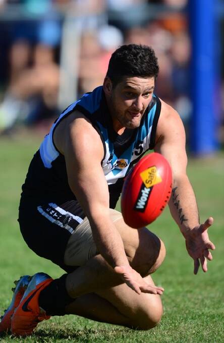 Former AFL player Brendan Fevola playing for Perth against St Pats yesterday.