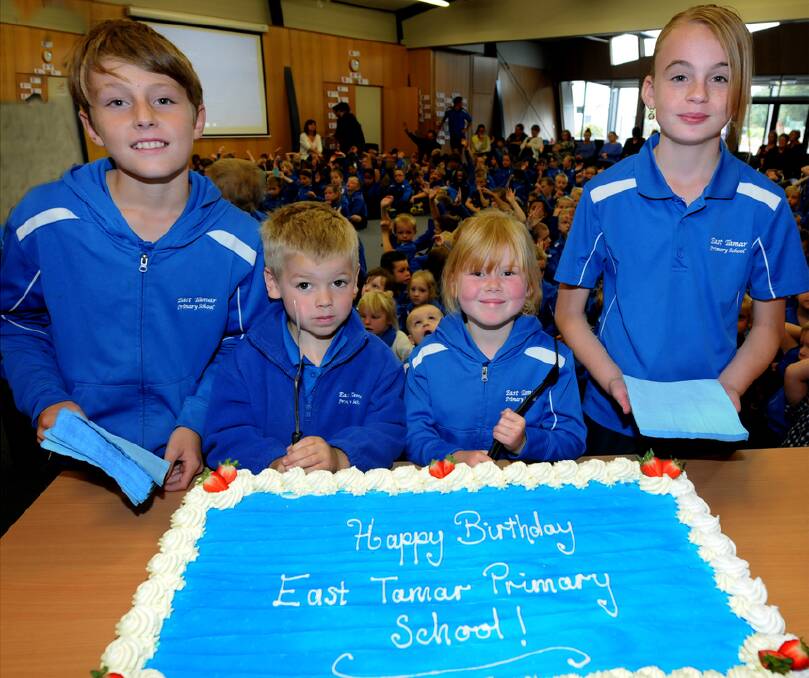 East Tamar Primary School celebtrates first birthdayRegan Alder 11, Tyler Oakley 5, Sophie Ellis 5 and Grace Holton 11 ready to tuck in to the birthday cake.