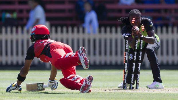 Safe: Chamari Attapattu of the Renegades makes her ground after an unsuccessful stumping attempt by Stafanie Taylor of the Thunder. Photo: AAP
