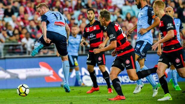 Tricky: David Carney backheels the ball on a night Sydney FC could do no wrong. Photo: AAP