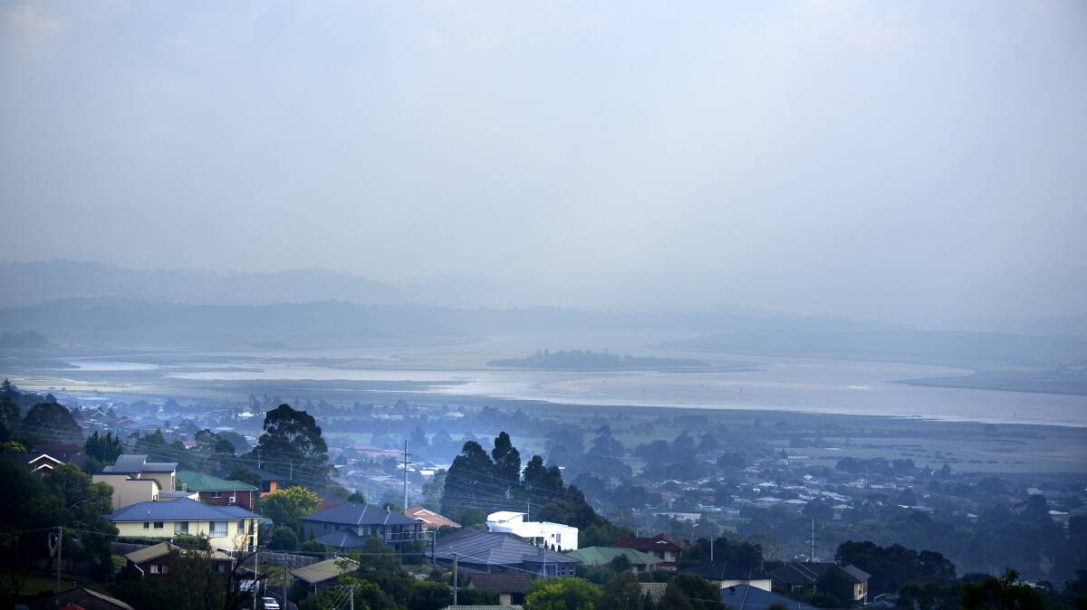 
Smoke from the bushfires in the North West hangs over the Tamar River on Sunday. The view from Trevallyn was hazy for most of the weekend. Picture: PAUL SCAMBLER
