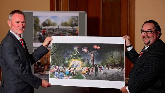 Launceston mayor Albert van Zetten and City Heart Reference Group chairman Darren Alexander hold artists impression of the planned Civic Square overhaul.