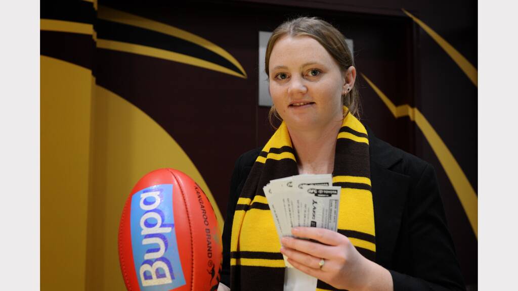 Hawthorn Tasmanian operations administrator Emma Davis with some tickets to next week's game. Picture: Scott Gelston.