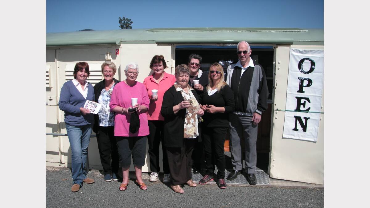 Helen Stingel, Jill Flowers, Sue Naylor, Cindy Walsh, Joyce Carr, Christine Reedman, Donna Wiffen and Ken Burr at the re-opened Ledgerwood Park tourist information railway carriage and kiosk.