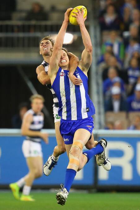 Jackson Thurlow attempts to spoil Ben Brown during Geelong's Friday night semi-final loss to North Melbourne. Picture: Getty Images, 