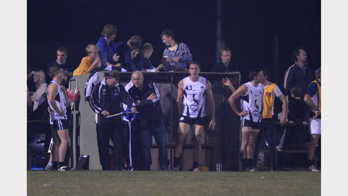 Former Carlton great Anthony Koutoufides holds his hamstring after limping from the ground in his guest appearance for Scottsdale last year.