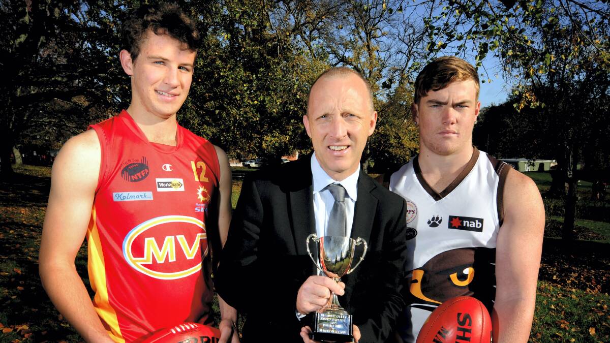Nick Cowan, of  the Meander Valley Suns, Meander Valley Mayor Craig Perkins and  Nick Claxton, of the Prospect Hawks, get ready for Saturday's clash for the  inaugural Meander Valley Mayor's Cup.  Picture: GEOFF ROBSON