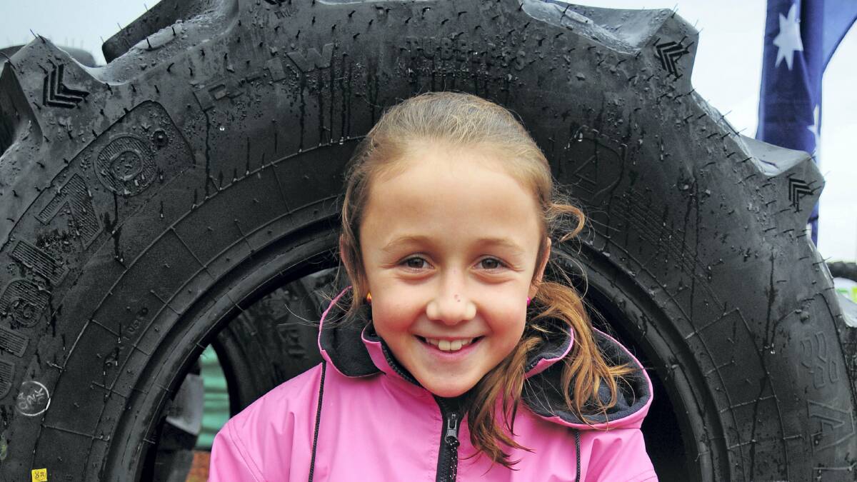 Trista Aylett, 9, of Elizabeth Town, checks out the big wheels.