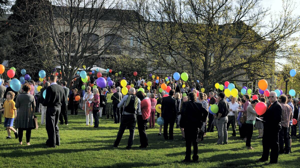 Biodegradable balloons in all colours of the rainbow were released in Launceston’s City Park after the funeral of Alderman Jeremy Ball.  Pictures: GEOFF ROBSON
