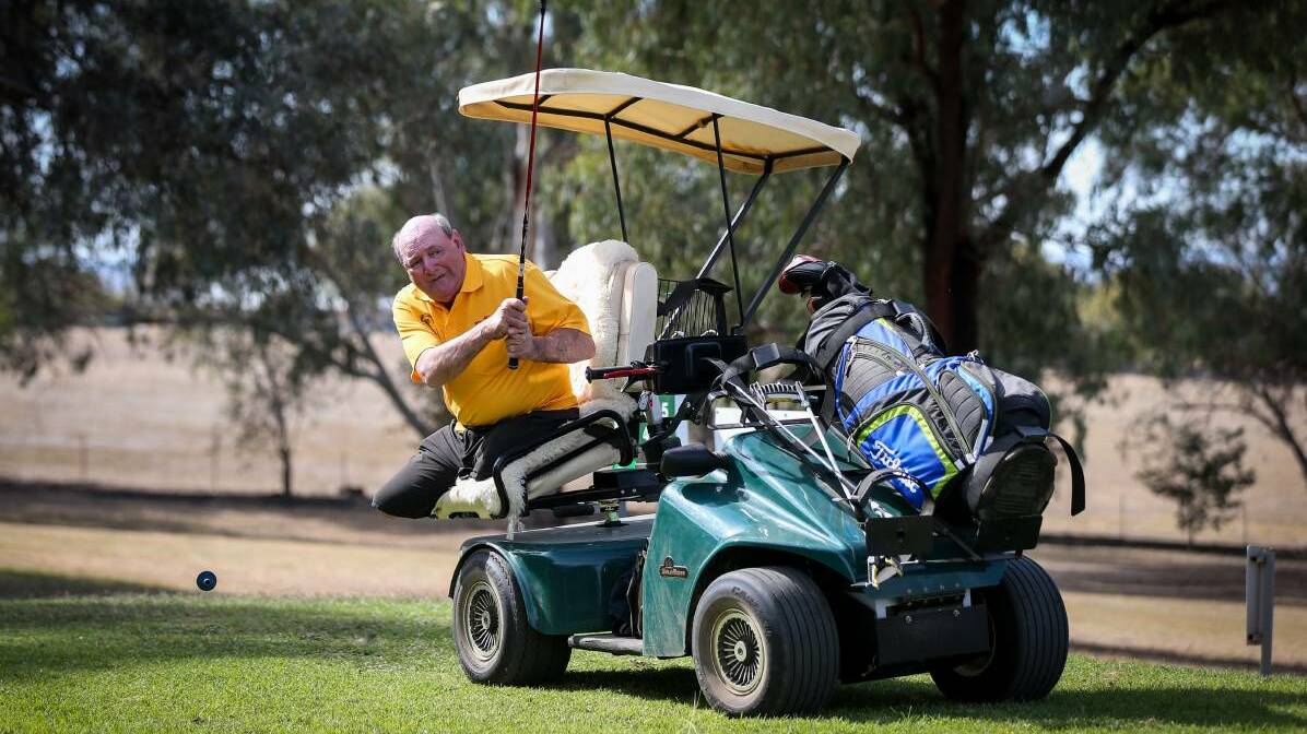 INSPIRATION: Thurgoona's Allan Justin hasn't let the loss of his legs get in the way of playing a relaxing game of golf. Picture: JAMES WILTSHIRE 