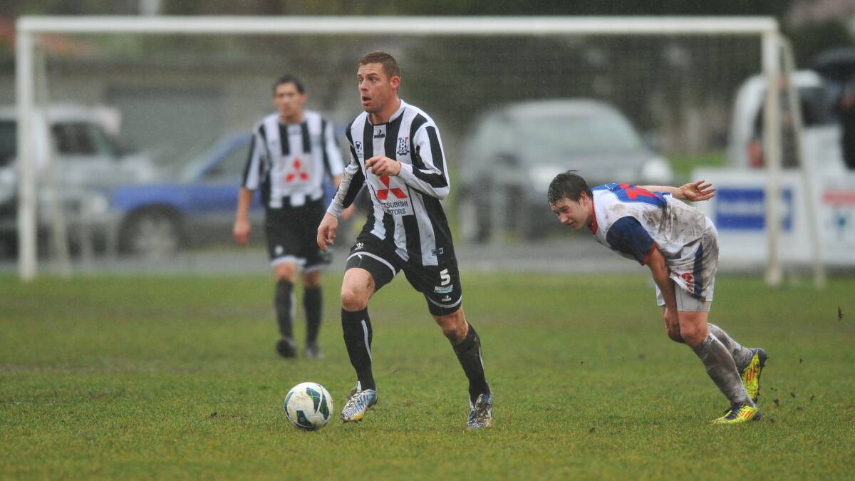 Former Socceroo Danny Allsopp leaves Northern Rangers' Aiden Rigby in his wake in his first appearance for Launceston City in the Victory League last year.
