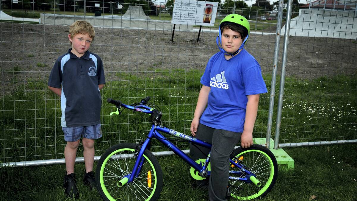 Mathew Dwyer, 7, and Seth Dwyer, 10, at the yet to be opened George Town skate park.  Picture: GEOFF ROBSON