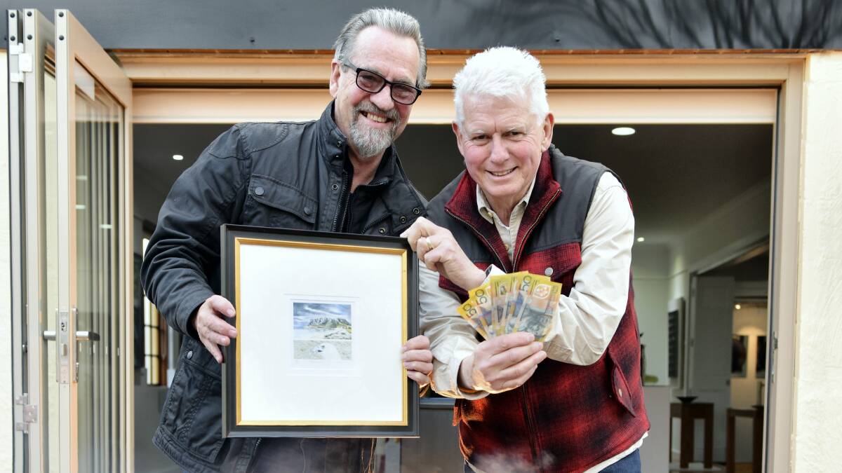 Artist and gallery curator Nigel Lazenby and Ronnie Burns, director of Appin Hall Children’s Foundation Respite Centre. Both are hopeful this painting isn’t destined for the bonfire.   Picture: BRODIE WEEDING