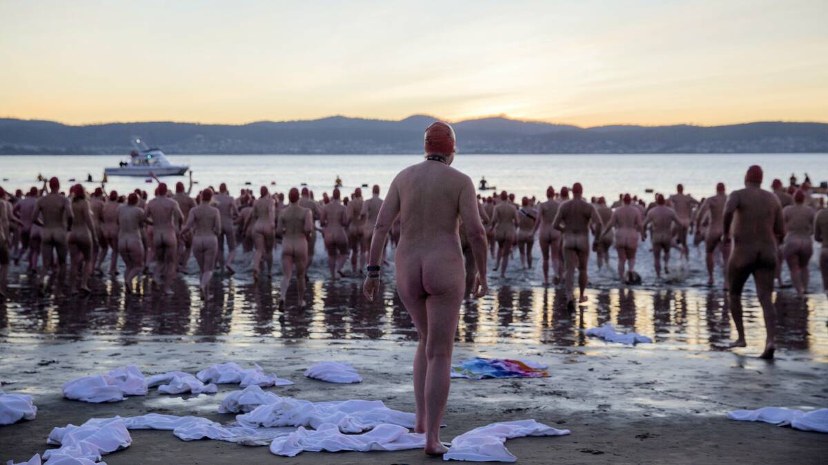  Hundreds of brave souls prepare for  nude swim as the sun rises over the chilly Derwent.     Picture:  MONA/VANESSA RITCHIE.
