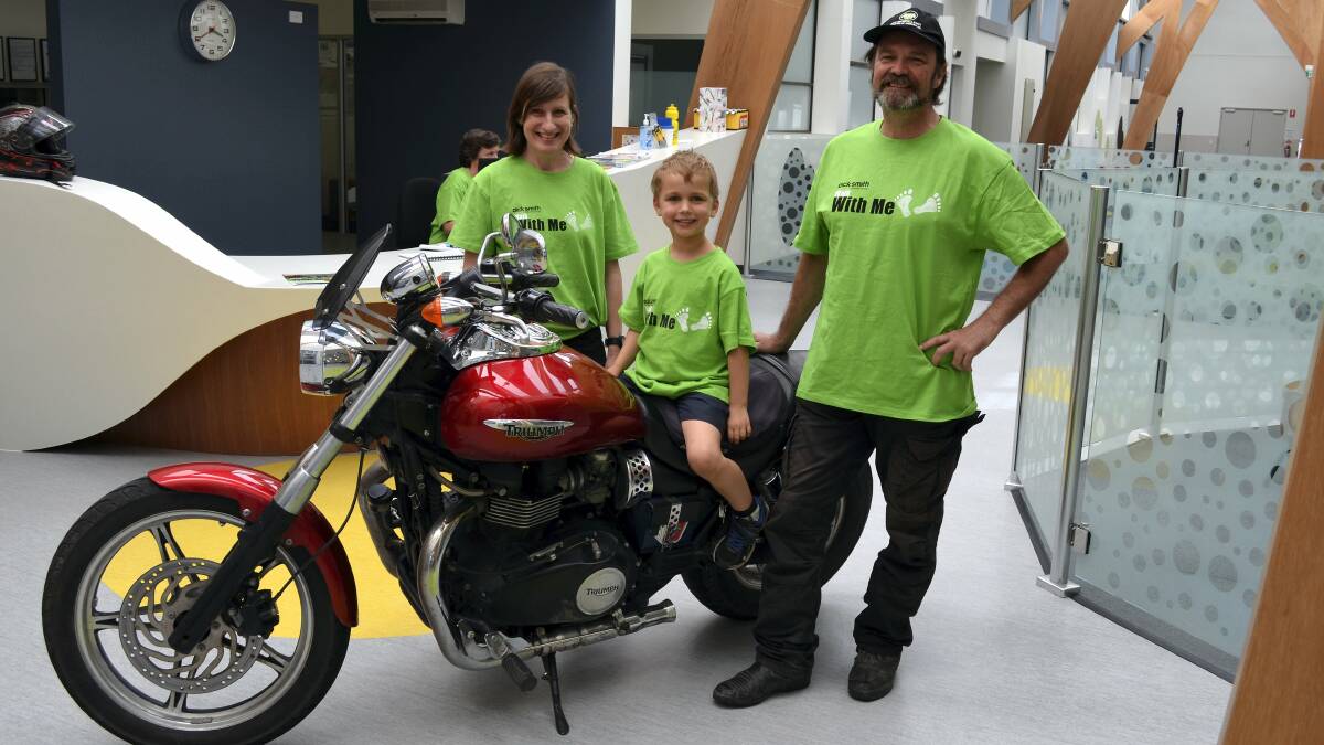 St Giles employee Janine Holloway, Lucas Millwood, 6, and Allan Roark, of the Motorcycle Riders Association, are preparing for the annual St Giles Walk With Me event on Saturday.
