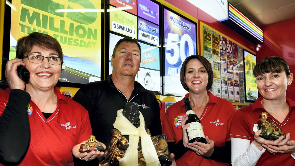 George Town NewsXpress owners Sue and Rick Sherriff celebrate with staff Tanya Nettlefold and Danielle Walsh the newsagency selling a million-dollar lotto ticket. Picture: NEIL RICHARDSON