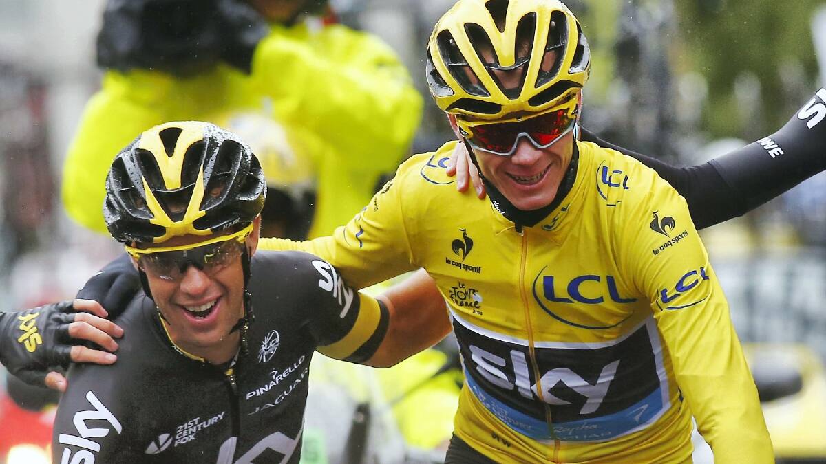 Tour de France winner  Chris Froome  celebrates with Team Sky teammate Richie Porte as they  complete the final stage on the  Champs-Elysees in Paris. Picture: GETTY IMAGES
