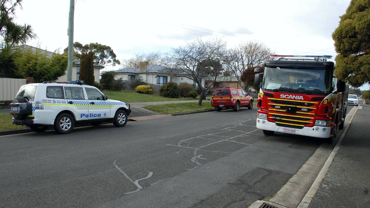 Emergency services at a fire at Summerhill that caused $80,000 damage to a house. Picture: CHRIS CLARKE 