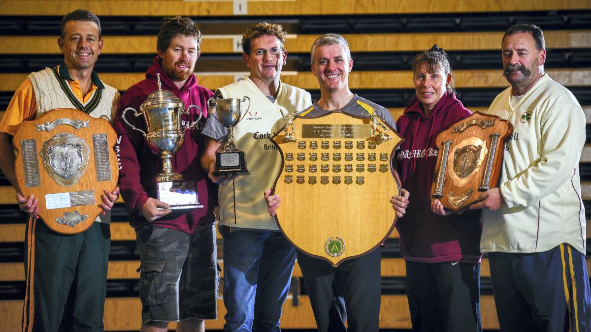 Showing some of the Westbury Cricket Club's trophies are  Luke McCormack, of St Patrick's College, Westbury's first grade captain Dane Anderson, Westbury coach Adrian Tudor, Westbury's third grade captain Dave Chambers, Gale Claxton, and Westbury president Michael Claxton.  PHILLIP BIGGS