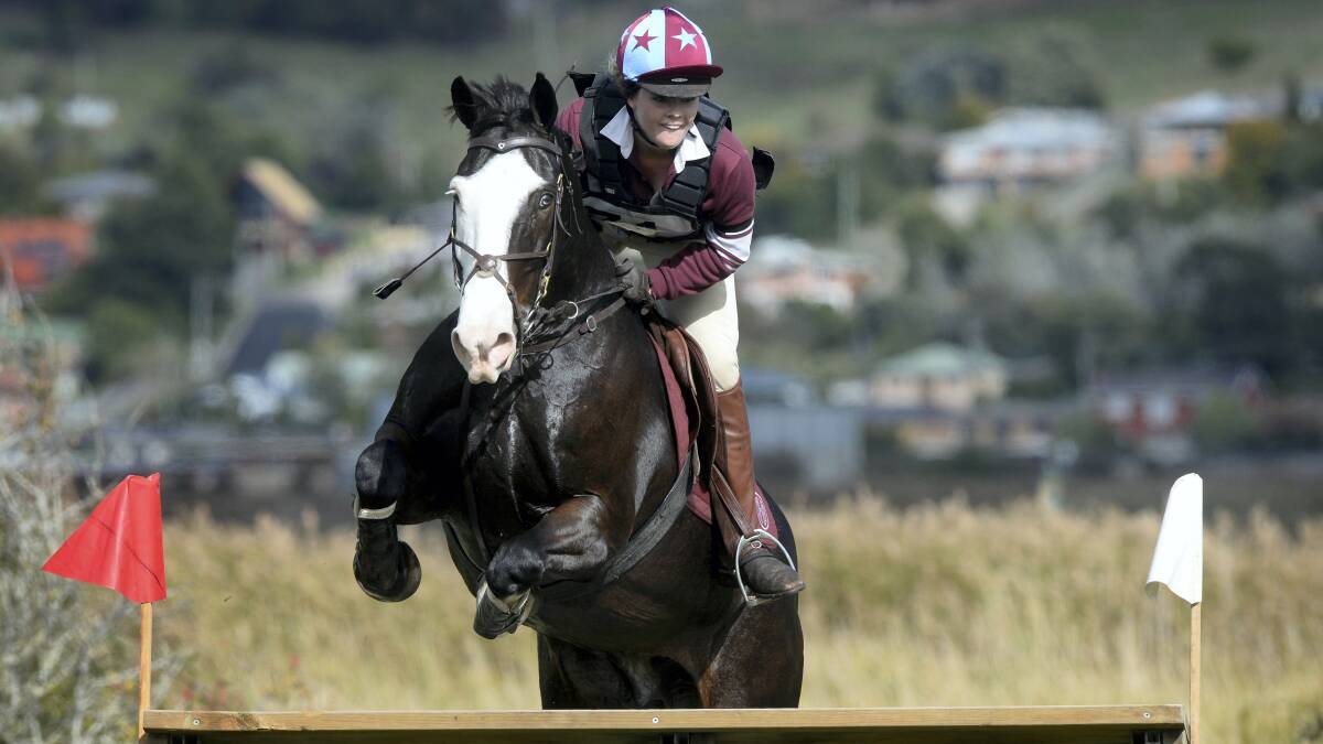 Heidi Quilliam, riding Sky High Flash, clears a jump in yesterday's state eventing championships.  Picture: MARK JESSER

 
