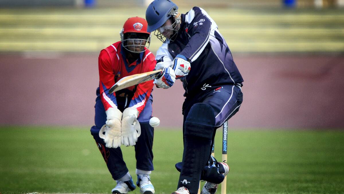 Devonport batsman Tyler Bell and Latrobe wicketkeeper James Hendrickson in action during the final.  Picture: GEOFF ROBSON