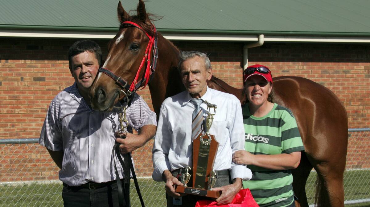 Owner-trainer Tommy Young, centre, with his son  Paul and strapper Fiona Daly  after his horse Gold Walk  won the 3YO Cup  in 2007.