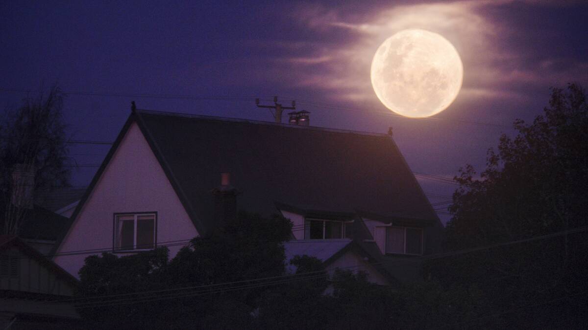 The supermoon over an East Launceston home. Picture: SCOTT GELSTON