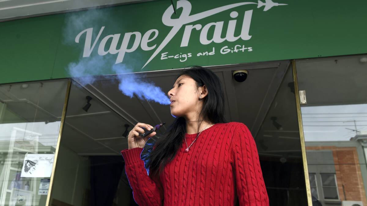 Vape Trail owner Lily Tran with an electronic cigarette. The former Sydney woman believes there are no better alternatives to tobacco cigarettes, while the Department of Health is keeping a watching brief on the issue of e-cigarettes.  Picture: MARK JESSER