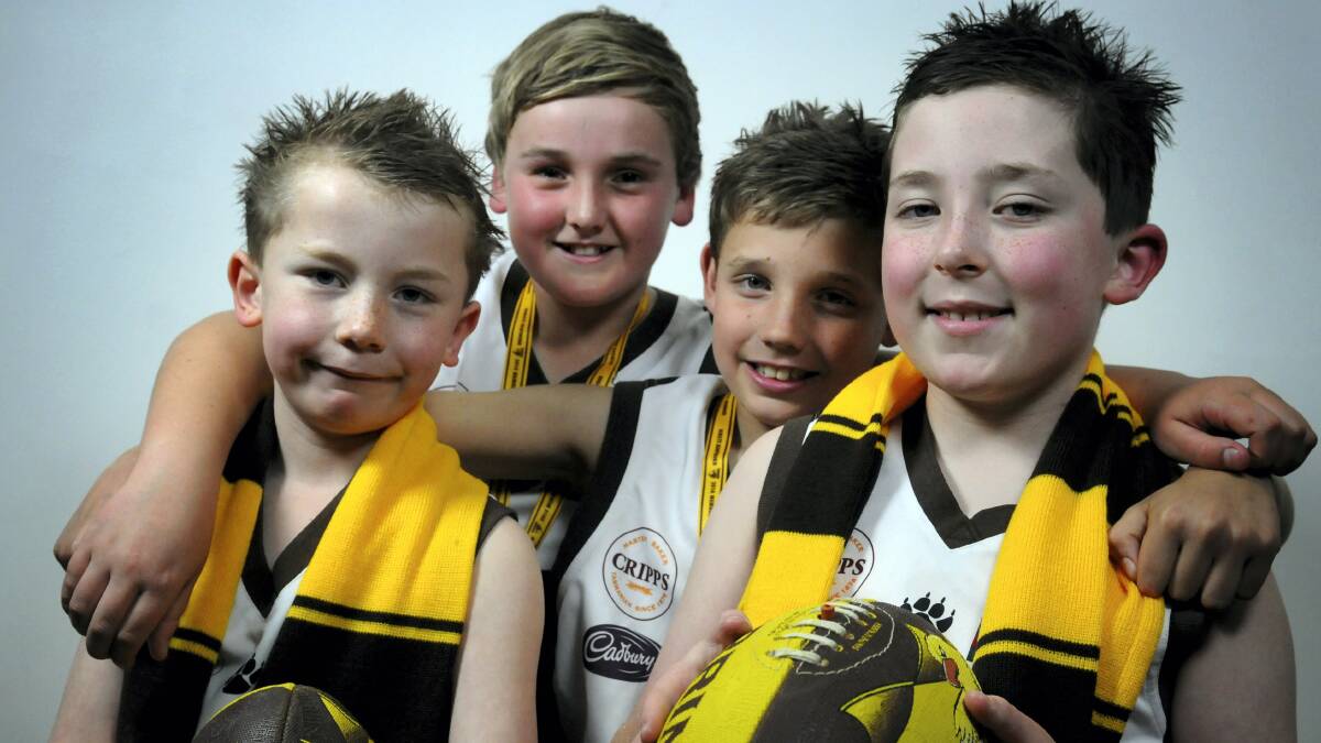 Isaac Smedley, 7, Liam Markham, 12, Cody Plummer, 9, and Malachie Smedley, 9, are ready to meet some of Hawthorn’s premiership players at Prospect Park today.  Picture: GEOFF ROBSON