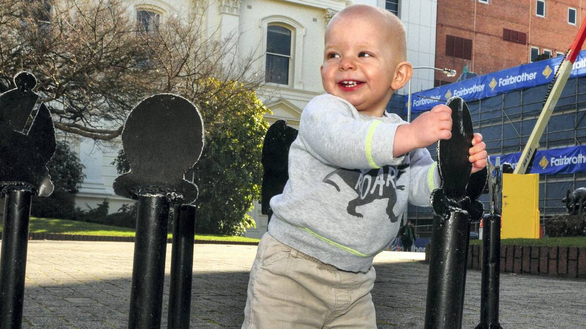 Launceston youngster Heath Ackerly, 14 months, enjoys playing with giant chess pieces in Civic Square, as part of a City Heart Project ideas display. Picture: NEIL RICHARDSON
