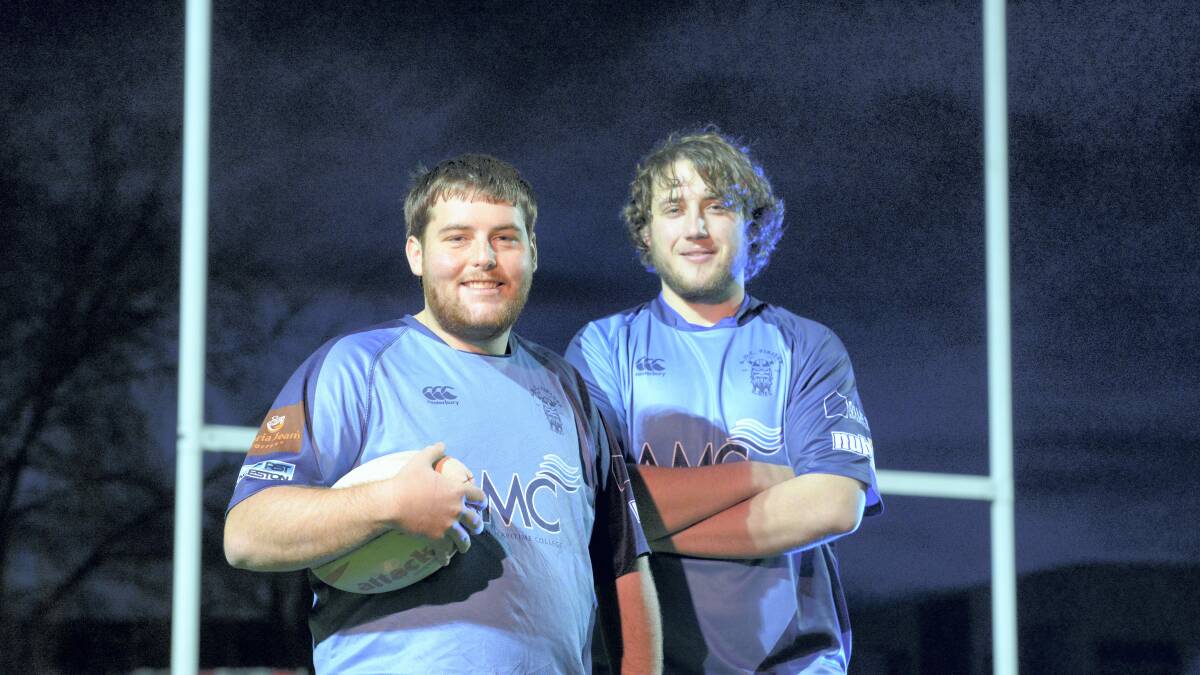 AMC Vikings captain Andrew Johnson with club president Jonathon Pini during training for their charity match to raise money for beyondblue. Picture: MARK JESSER
