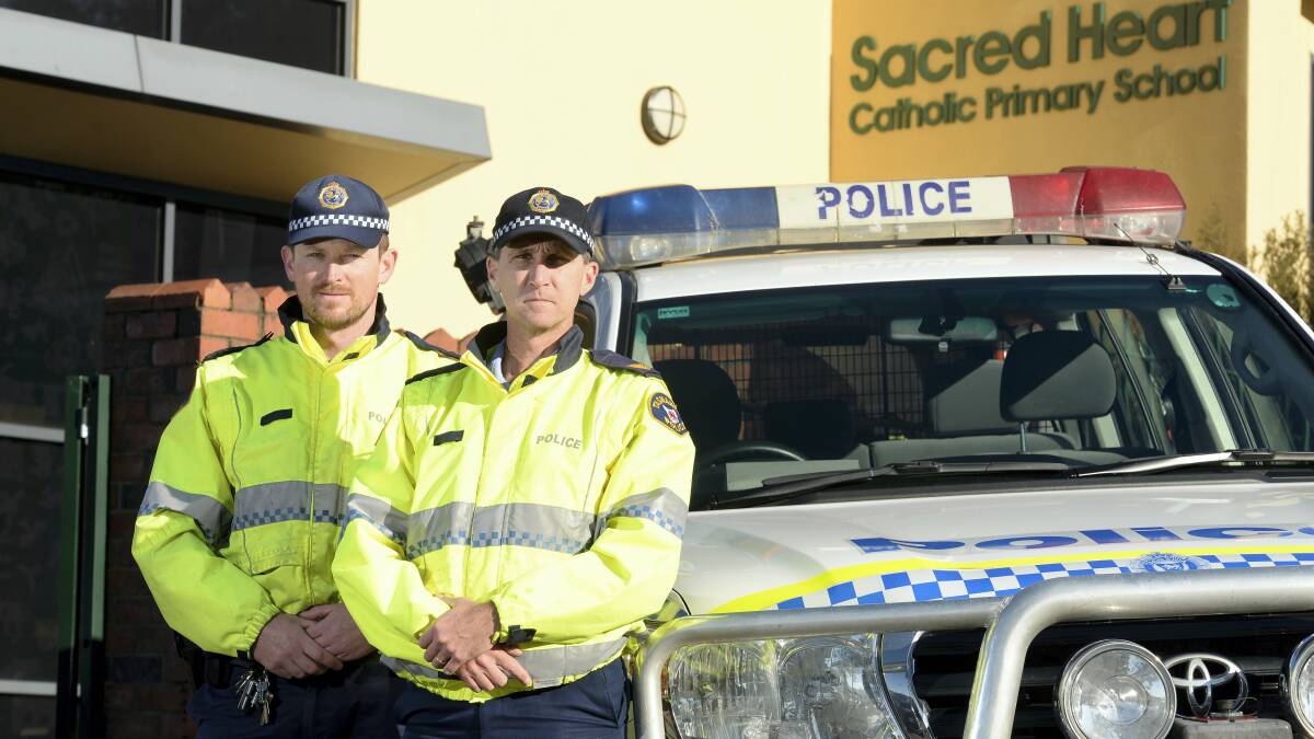 Senior Constable Michal Rybka and Sergeant Nick Clark get ready for a school area safety campaign starting tomorrow in the North. Picture: MARK JESSER