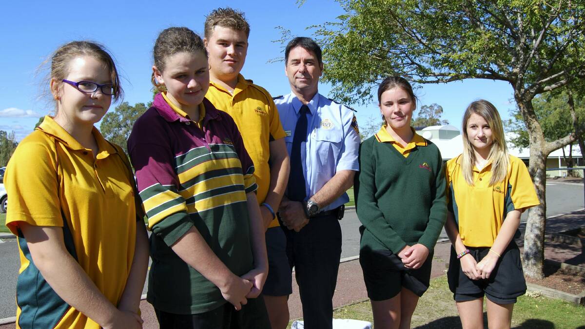 Tasmania Police Northern Commander Richard Cowling, centre, commends Brooks High School students   Emmily Davie, Chloe Burnie, Nick Hammersley,  Lauren McCabe and Tyeka Holmes  for their quick action when a fire broke out near the school.

