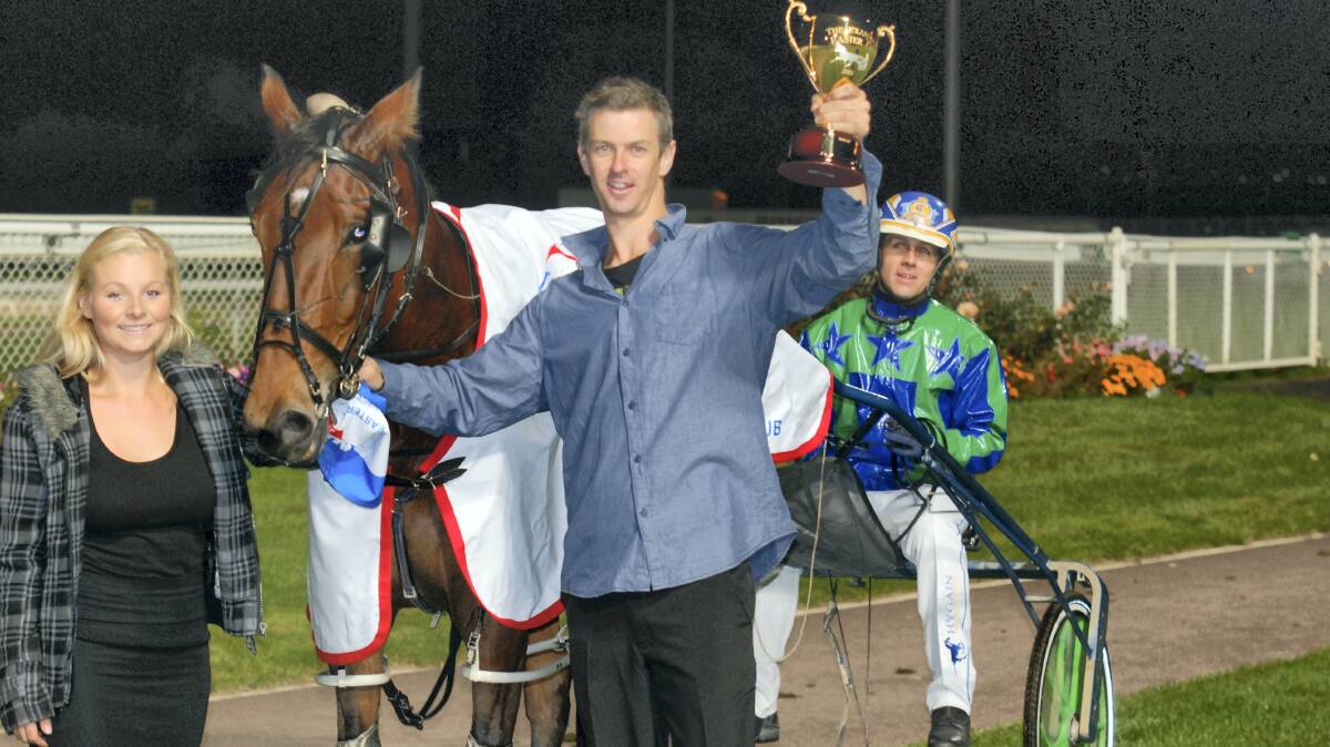 Easter Cup winner Motu Crusader with stable assistant Kymberley Barr, trainer Zeke Slater and driver Grant Campbell.

 Picture: TASRACING