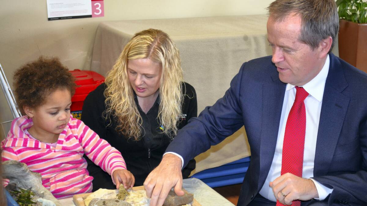 Discovery Early Learning Centre director Brooke Conley and Opposition Leader Bill Shorten join in playtime in Hobart yesterday. Picture: GEORGIE BURGESS