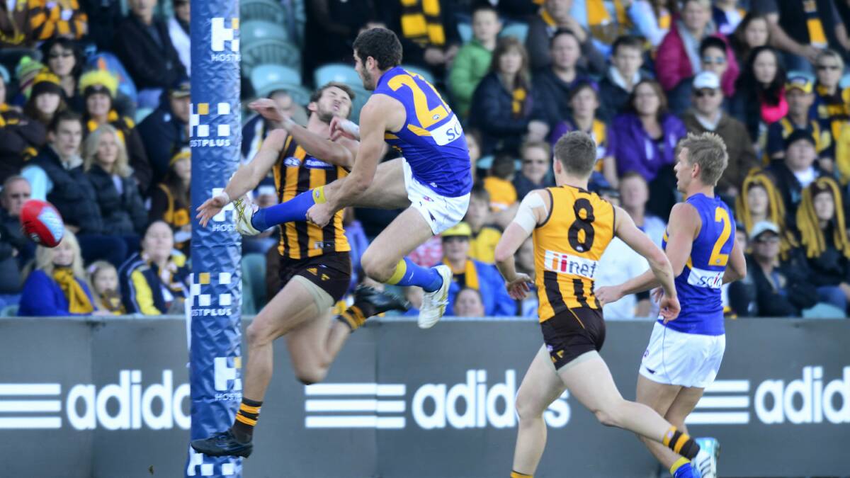 West Coast's Jack Darling leaps for a mark in yesterday's loss to Hawthorn.