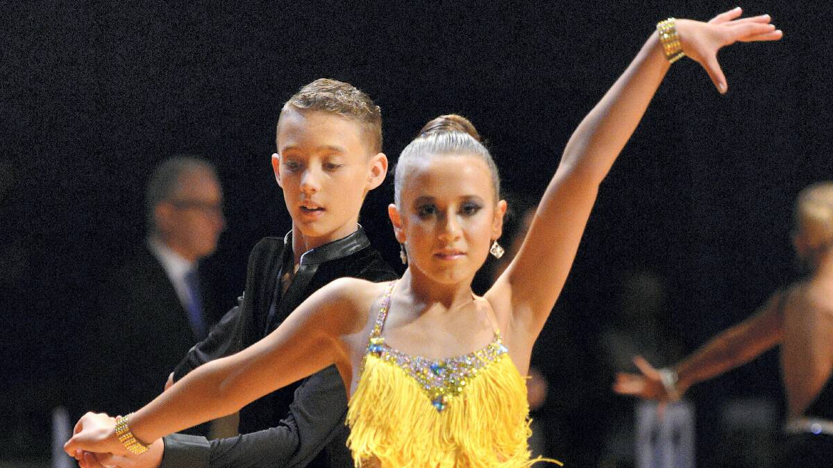 Jaxon Putlane, 12, and Yianna Layton, 13, of Melbourne, show their style at the Tasmanian DanceSport Championships. 